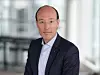 Portrait of Anko van der Werff in a dark suit against a blurred office background.