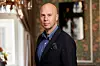 Best Western Hotels CEO Johan Michelson standing indoors in a hotel setting.