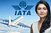 En IATA-logotyp, ett flygplan och ett porträtt av Saadia Zahidi, ny generaldirektör för IATA, mot en blå himmel.